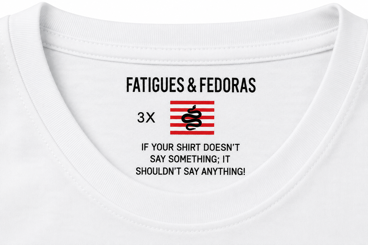 This isn’t a blank tee with a print slapped on it.
Every piece in the Revisionist™ Collection is branded from the inside out.

The interior neck print features the official Fatigues & Fedoras insignia alongside the brand manifesto:

“IF YOUR SHIRT DOESN’T SAY SOMETHING; IT SHOULDN’T SAY ANYTHING!”